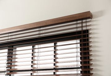 Beautiful wooden blinds on a window with a view.