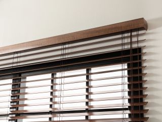 Beautiful wooden blinds on a window with a view.